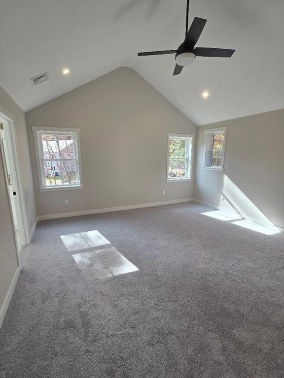 interior space with lofted ceiling and ceiling fan