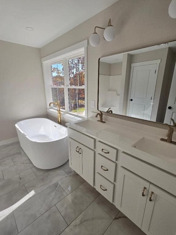 bathroom featuring vanity and a bath