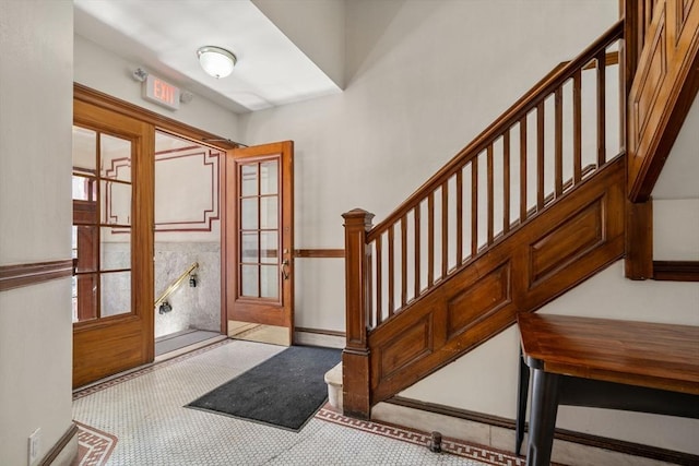 interior space featuring stairway and baseboard heating