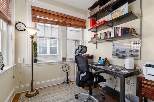 office with baseboards and wood finished floors