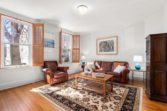 living room featuring light wood finished floors and baseboards