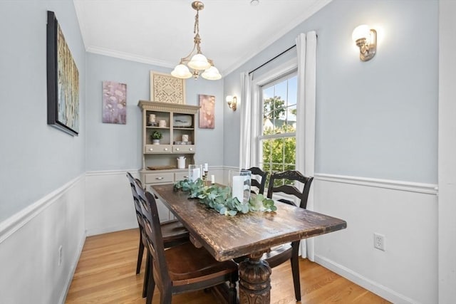 337-339 Gallivan Blvd Unit 2, Boston, MA 02124 - dining space with crown molding, light wood-type flooring, and a wainscoted wall