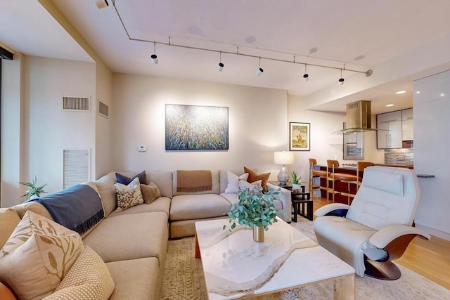 living room with light hardwood / wood-style floors