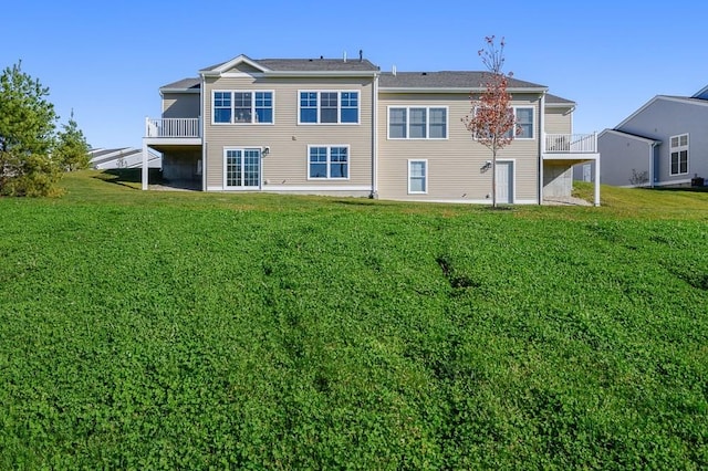 rear view of house with a lawn