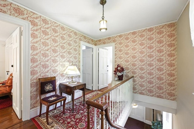 96 College St, South Hadley, MA 01075 - corridor featuring wallpapered walls, wood finished floors, wainscoting, and ornamental molding