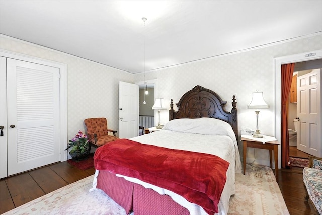 96 College St, South Hadley, MA 01075 - bedroom featuring wood-type flooring, wallpapered walls, and a closet