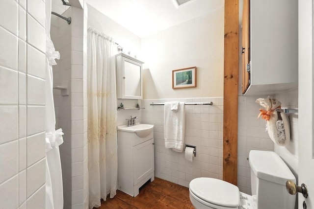 96 College St, South Hadley, MA 01075 - full bathroom featuring tile walls, toilet, vanity, wood finished floors, and curtained shower