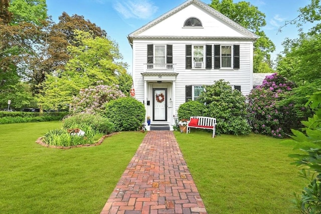 96 College St, South Hadley, MA 01075 - neoclassical / greek revival house featuring a front yard and a balcony