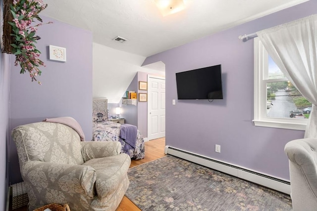 137 Pond, Westwood, MA 02090 - living area featuring baseboard heating, light wood-type flooring, and vaulted ceiling