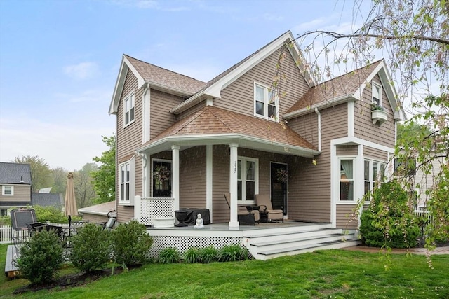 137 Pond, Westwood, MA 02090 - back of property with a yard and a shingled roof