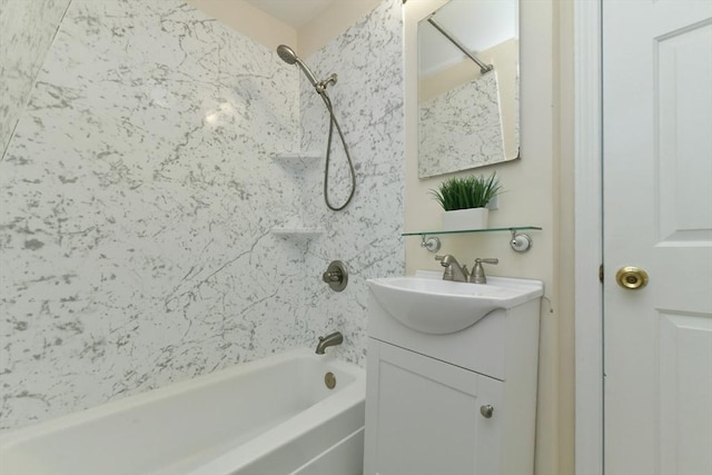 bathroom with vanity and tiled shower / bath combo