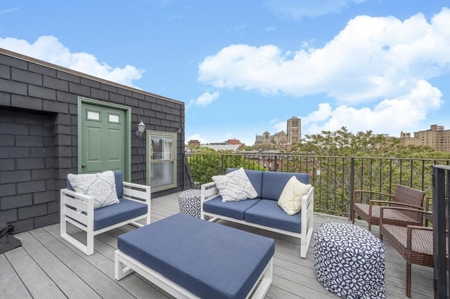 wooden terrace featuring outdoor lounge area