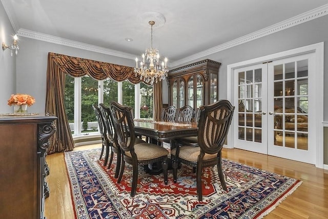 18 Village Hill Rd, Dover, MA 02030 - dining area with french doors, a chandelier, wood finished floors, and ornamental molding