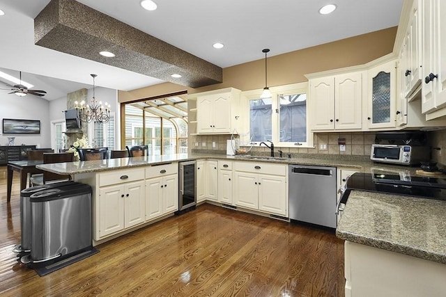 18 Village Hill Rd, Dover, MA 02030 - kitchen with stainless steel appliances, a peninsula, a sink, wine cooler, and ceiling fan