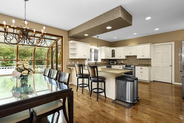 18 Village Hill Rd, Dover, MA 02030 - kitchen featuring stainless steel range with electric stovetop, open shelves, decorative backsplash, a peninsula, and recessed lighting