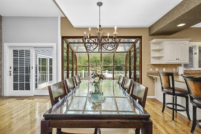 18 Village Hill Rd, Dover, MA 02030 - dining room with light wood-style flooring and a chandelier