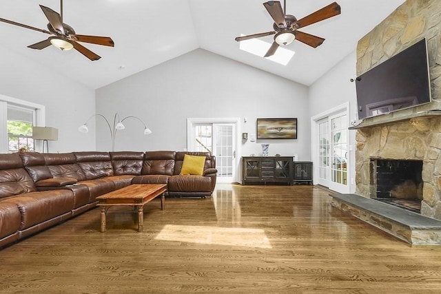 18 Village Hill Rd, Dover, MA 02030 - living area featuring a skylight, wood finished floors, high vaulted ceiling, ceiling fan, and healthy amount of natural light
