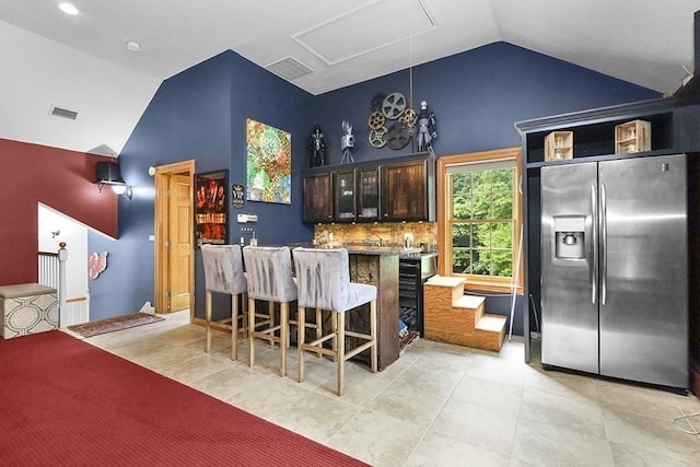 18 Village Hill Rd, Dover, MA 02030 - bar area featuring stainless steel refrigerator with ice dispenser, light tile patterned floors, and high vaulted ceiling