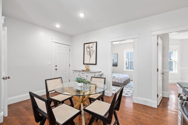 dining room with recessed lighting, wood finished floors, and baseboards