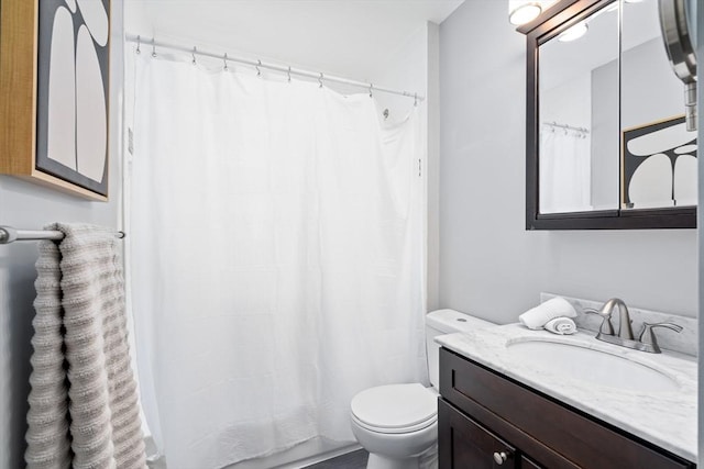 full bath with a shower with curtain, toilet, and vanity