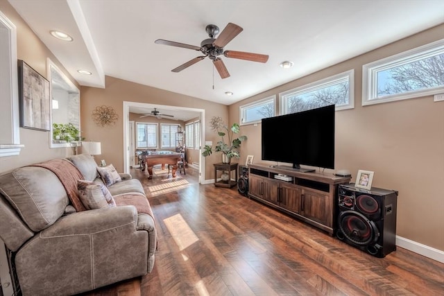 living area with plenty of natural light, baseboards, wood finished floors, and recessed lighting