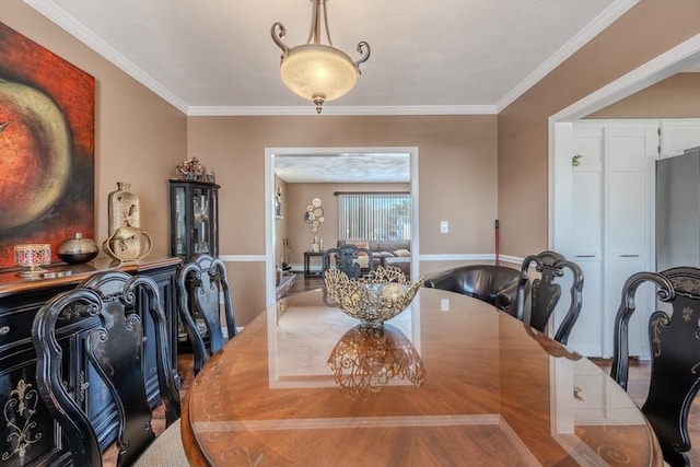 dining area featuring ornamental molding