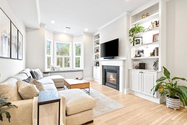 356 Bunker Hill St Unit 2, Boston, MA 02129 - living area featuring light wood finished floors, a fireplace, built in shelves, recessed lighting, and crown molding