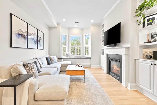 356 Bunker Hill St Unit 2, Boston, MA 02129 - living room with light wood finished floors, ornamental molding, a fireplace, recessed lighting, and built in shelves