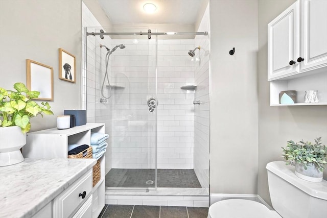 356 Bunker Hill St Unit 2, Boston, MA 02129 - bathroom with toilet, a stall shower, vanity, and tile patterned floors