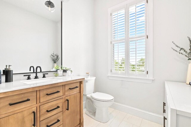 356 Bunker Hill St Unit 2, Boston, MA 02129 - bathroom featuring vanity, baseboards, and toilet