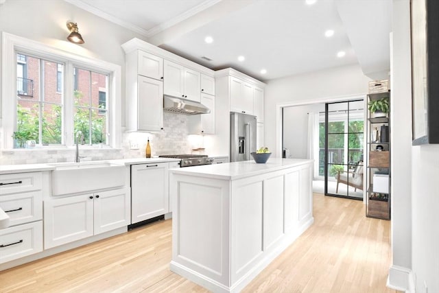 356 Bunker Hill St Unit 2, Boston, MA 02129 - kitchen with high quality fridge, a sink, under cabinet range hood, backsplash, and crown molding