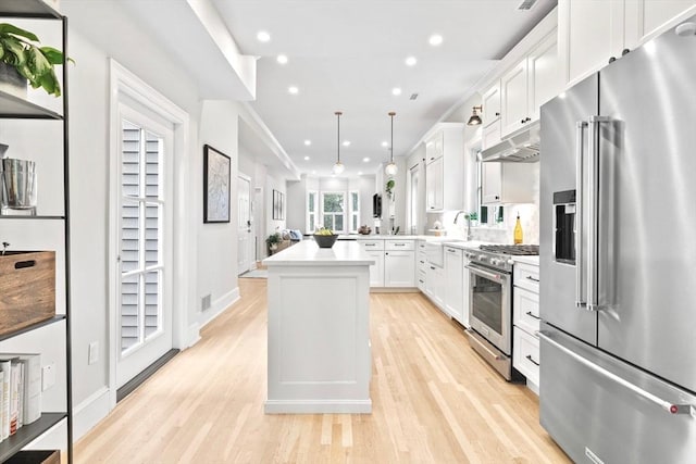 356 Bunker Hill St Unit 2, Boston, MA 02129 - kitchen with high quality appliances, recessed lighting, light wood finished floors, light countertops, and under cabinet range hood