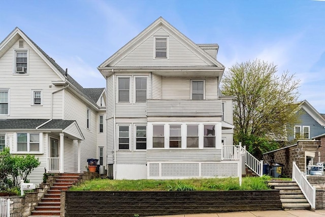 view of front of home with stairway