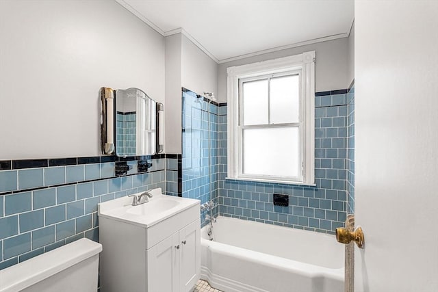 bathroom featuring toilet, tile walls, healthy amount of natural light, vanity, and crown molding