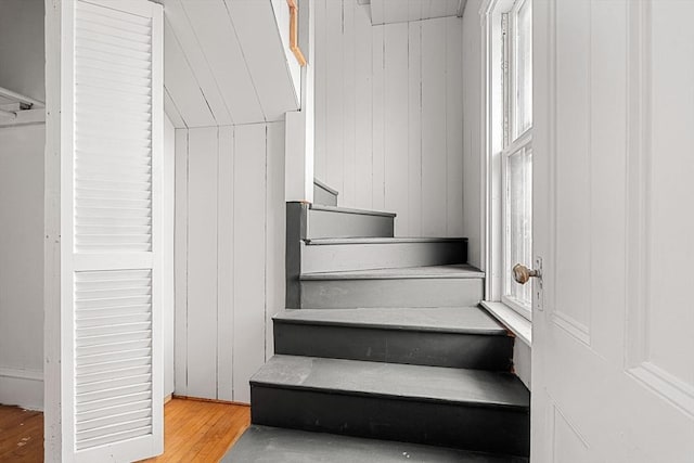 staircase with wood finished floors