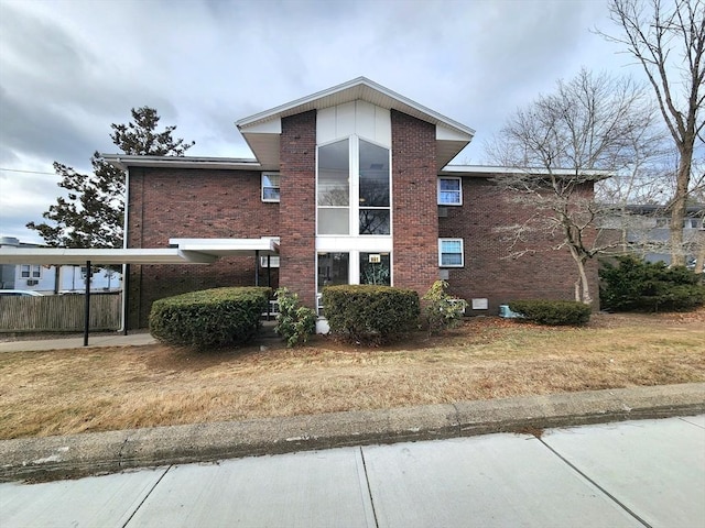 view of property exterior with a carport