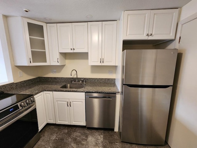 kitchen featuring sink, white cabinetry, and stainless steel appliances