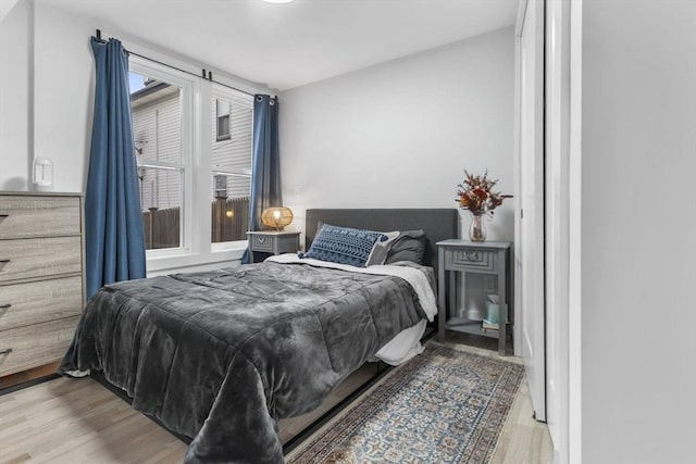 bedroom with light hardwood / wood-style flooring