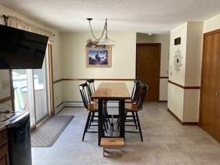 dining room featuring baseboards