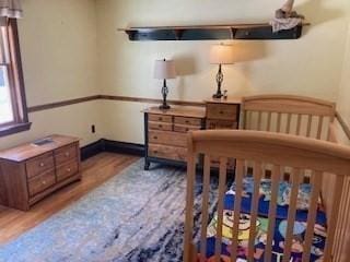 bedroom featuring wood finished floors