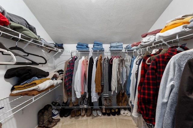 walk in closet featuring carpet