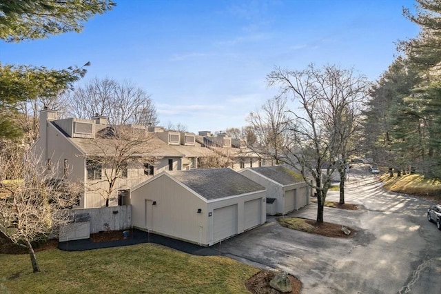 view of side of home featuring a lawn