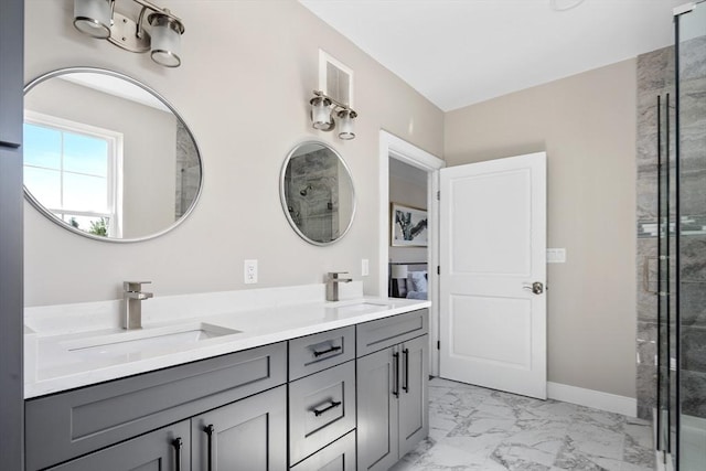 full bathroom with a sink, baseboards, double vanity, and marble finish floor