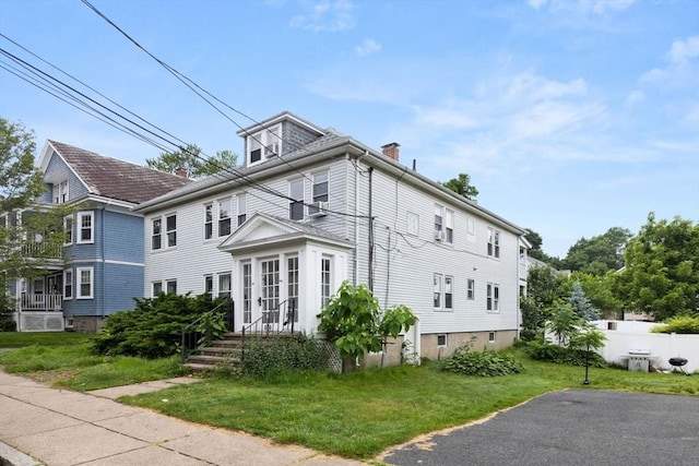 18-20 Presentation Rd, Boston, MA 02135 - view of home's exterior with a chimney