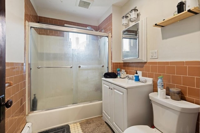 18-20 Presentation Rd, Boston, MA 02135 - bathroom with tile walls, vanity, shower / bath combination with glass door, healthy amount of natural light, and a wainscoted wall