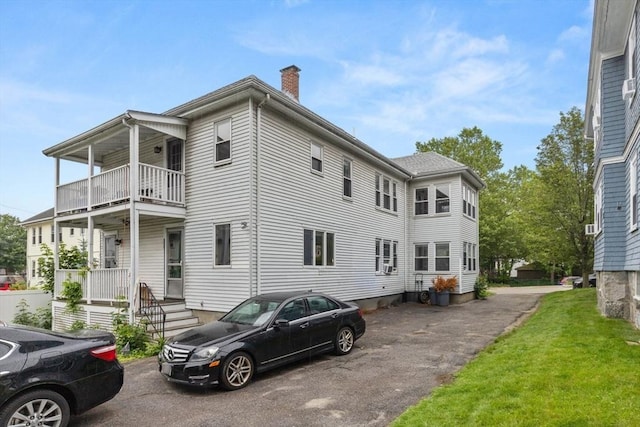 18-20 Presentation Rd, Boston, MA 02135 - view of front of property with a balcony and a chimney