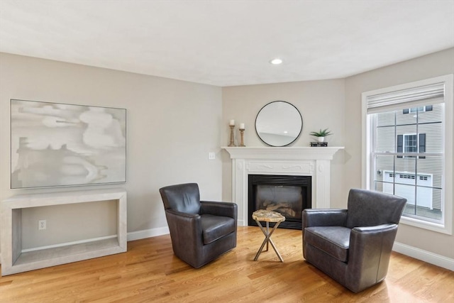 7 Acorn Way, Georgetown, MA 01833 - living area with baseboards, light wood-style floors, a glass covered fireplace, and recessed lighting