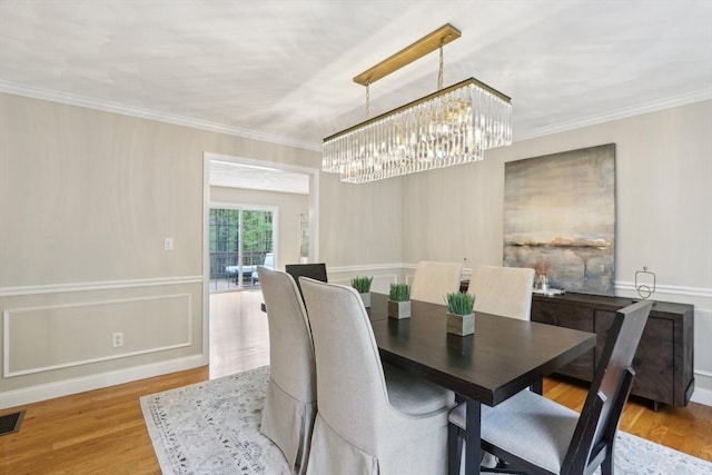 7 Acorn Way, Georgetown, MA 01833 - dining area featuring a chandelier, ornamental molding, and light wood finished floors