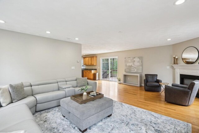7 Acorn Way, Georgetown, MA 01833 - living room with light wood-style flooring, recessed lighting, and a glass covered fireplace