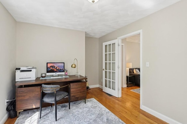 7 Acorn Way, Georgetown, MA 01833 - office area with wood finished floors, baseboards, and french doors